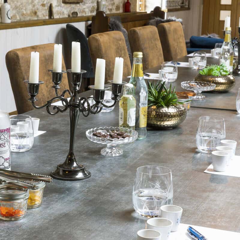 Dunnet Bay Distillery Tasting Table with printed tasting sheets, tumbles and glass