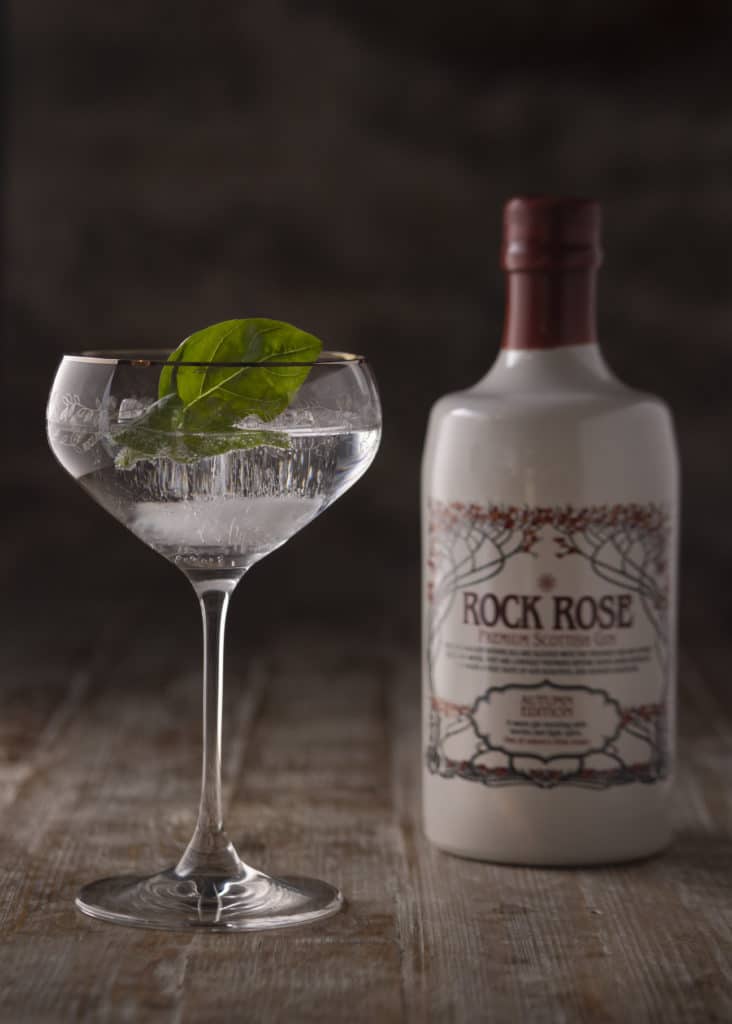 Rock Rose Gin Autumn Edition and perfect serve in a coupe glass garnished basil leaf