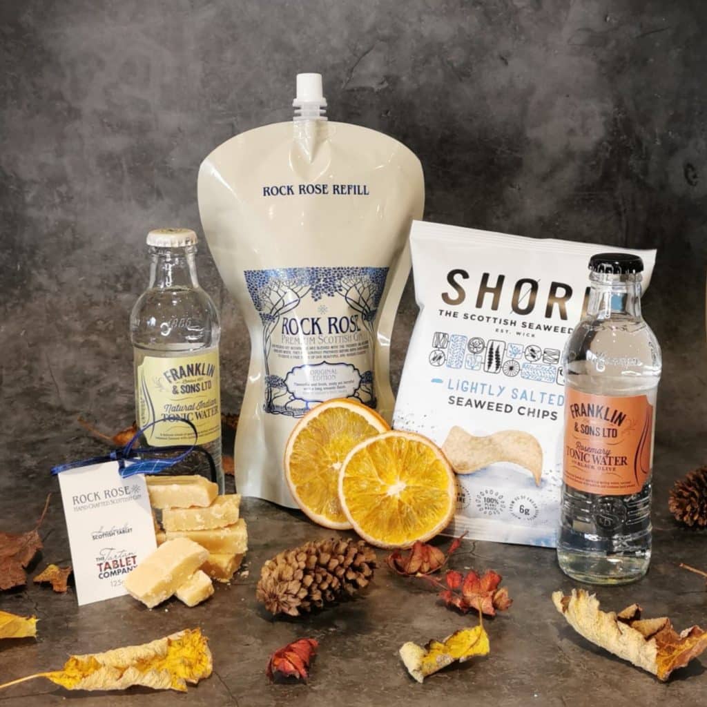 Content of the Refill Rewards Club box for October 2020 including Rock Rose Gin pouch, accompanying mixers and a wee surprise or two
