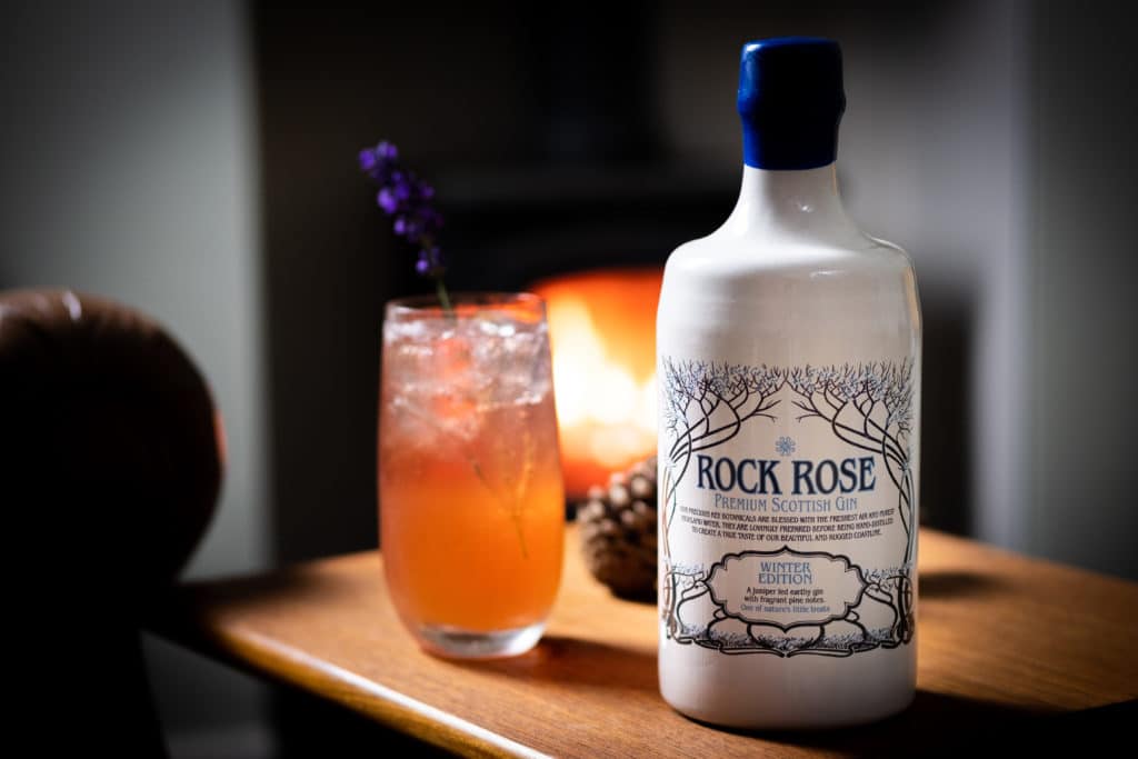 Bottle of Rock Rose Gin and Force My Hand Cocktail served in a tall glass
