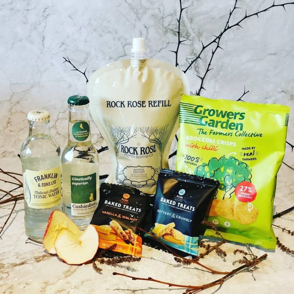 Content of the Refill Rewards Club box for January 2021 including Rock Rose Gin pouch, tonic waters, broccoli crisps and shortbreads