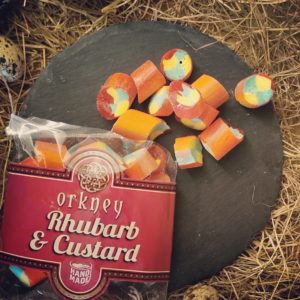 Bag of Orkney Rhubarb and Custard Sweets on straw