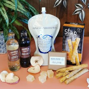 Content of the Refill Rewards Club box for May 2021 including Holy Grass Vodka pouch, tonic waters, Stag Cheese straws and Rock Rose Gin & Tonic treats