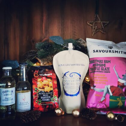 Content of the Refill Rewards Club box for December 2021 including Holy Grass Vodka pouch, tonic waters. Ham and Truffle crisps and mini start shortbreads