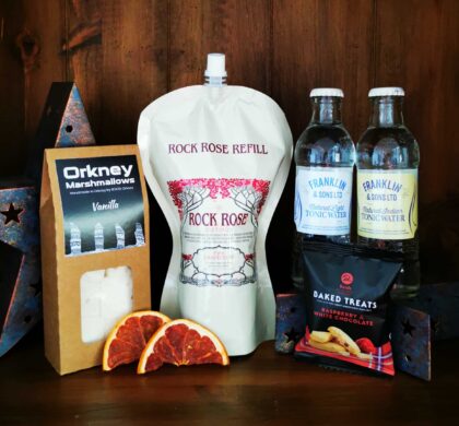 Content of the Refill Rewards Club box for February 2022 including Rock Rose Gin pouch, tonic waters, marshmallows and shortbreads